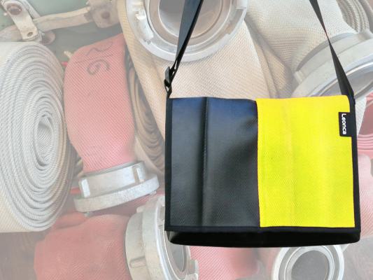 Upcycling Bags made from a used yellow fire hose and tarpaulin